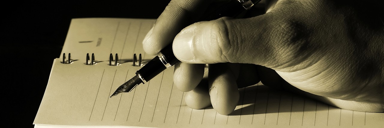 To the Person Sitting Down to Write Your Suicide Note writing in a notebook