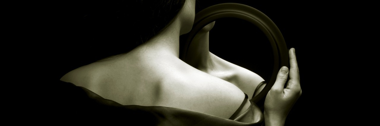 The Ups and Downs of Eating Disorder Recovery girl looking at reflection