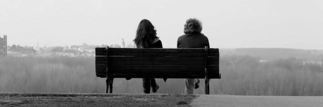 Grief: What to Say and Not to Say to a Grieving Daughter Black and white photo of two people sitting on a bench