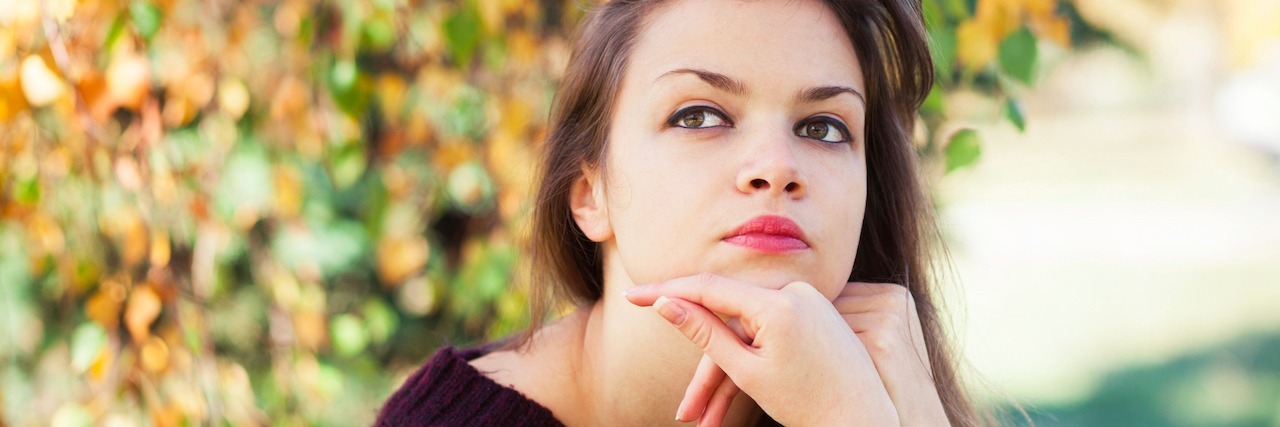 What Question Helps Me When I'm Struggling With Anxiety a young girl sitting by a tree