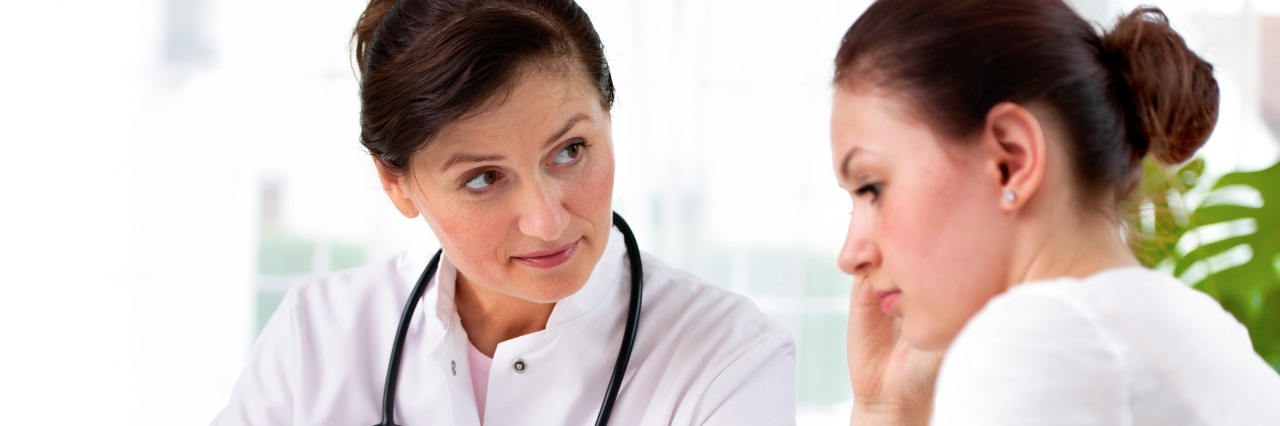 What Life Is Like With Rheumatoid Arthritis doctor explaining diagnosis to female patient