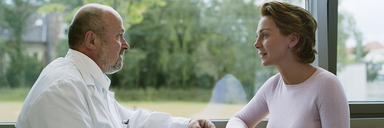 Bipolar Disorder Basics for the Newly Diagnosed Male doctor sitting with female patient