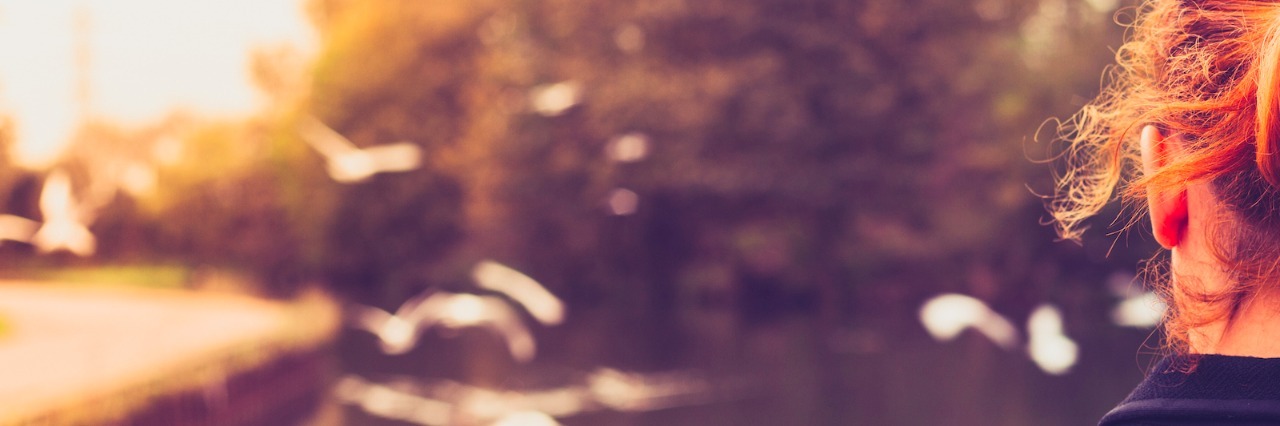 What My Life Is Like Because of My Autism Woman looking at birds flying over water