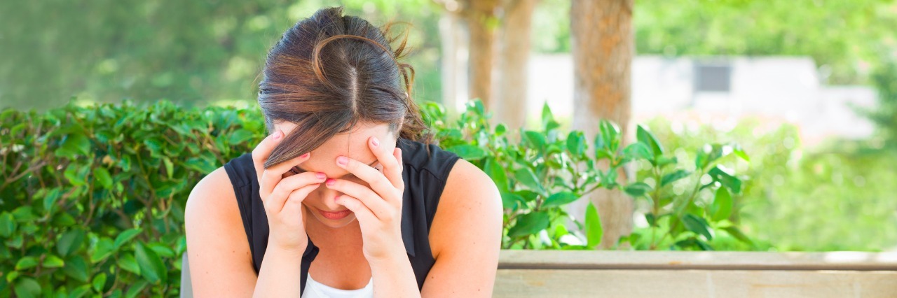 The Problem With This 'Funny' Meme That Jokes About Suicide in College Upset Young Woman Sitting Alone on Bench Next to Books