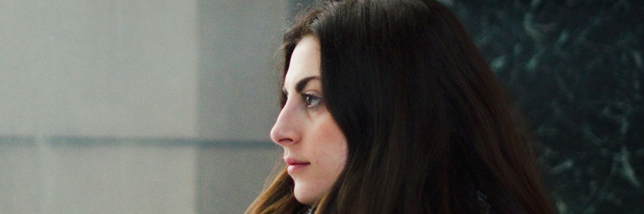 Surviving the Holidays After a Suicide Attempt girl by christmas tree