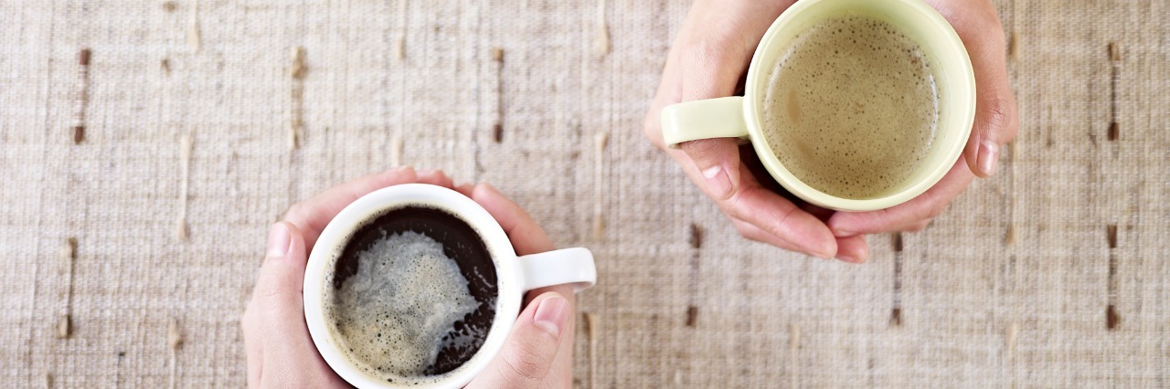 Talking With Loved Ones About Depression and Suicidal Ideation hands holding coffee