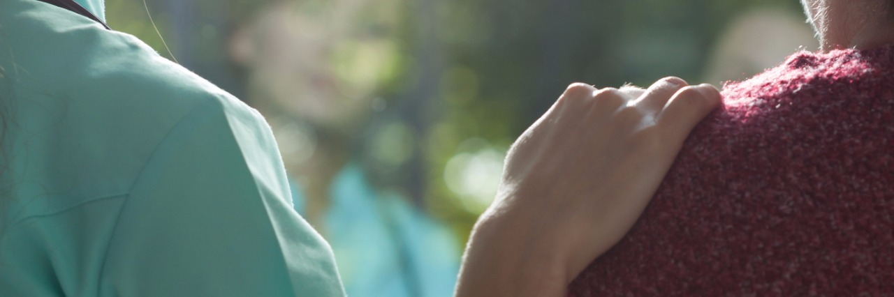 Letter to Medical Student Who Comforted Mental Health Patient young nurse comforting female patient with a hand on her shoulder