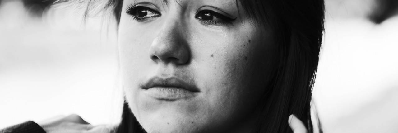 The Horror of an Anxiety Attack Crying girl attempting to smile