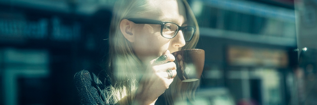 Autism: Why I Struggle Socially woman having coffee while using laptop in cafe