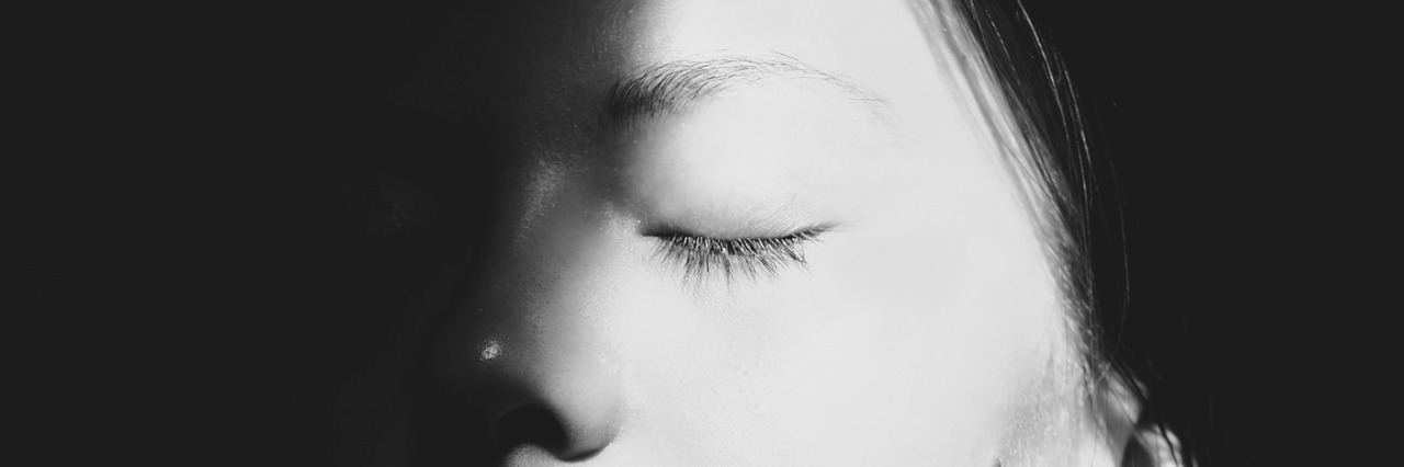 Silhouette Face of an Asian Woman with Closed Eyes