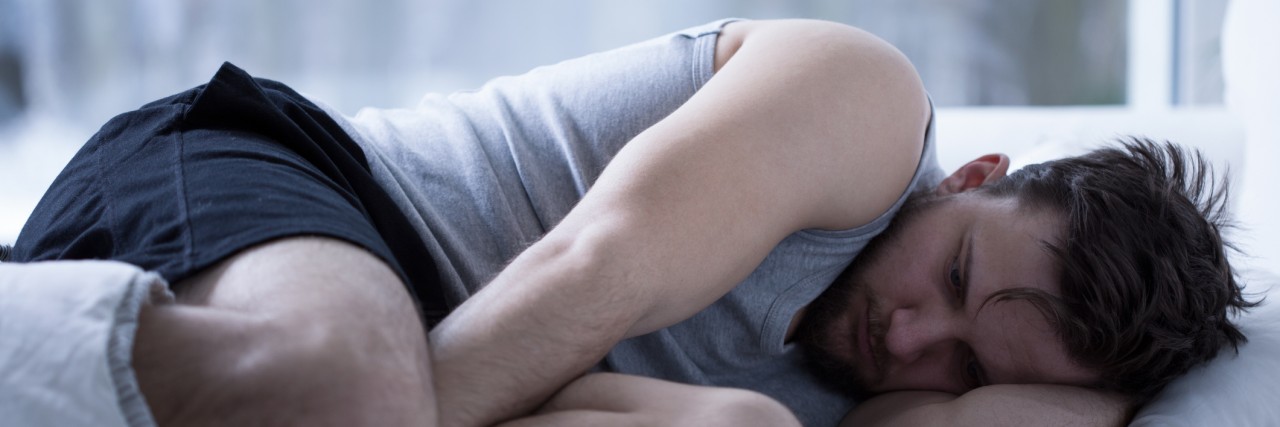 Learning to Control My Anxiety and Panic Attacks: 4 Key Lessons man Trying to fall asleep after the sleepless night