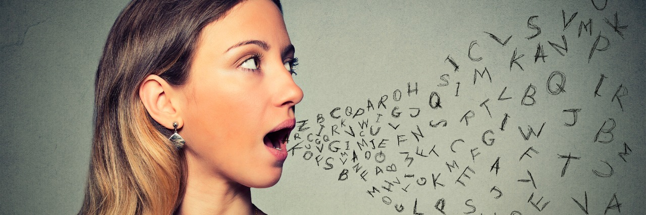 woman talking with alphabet letters coming out of her mouth