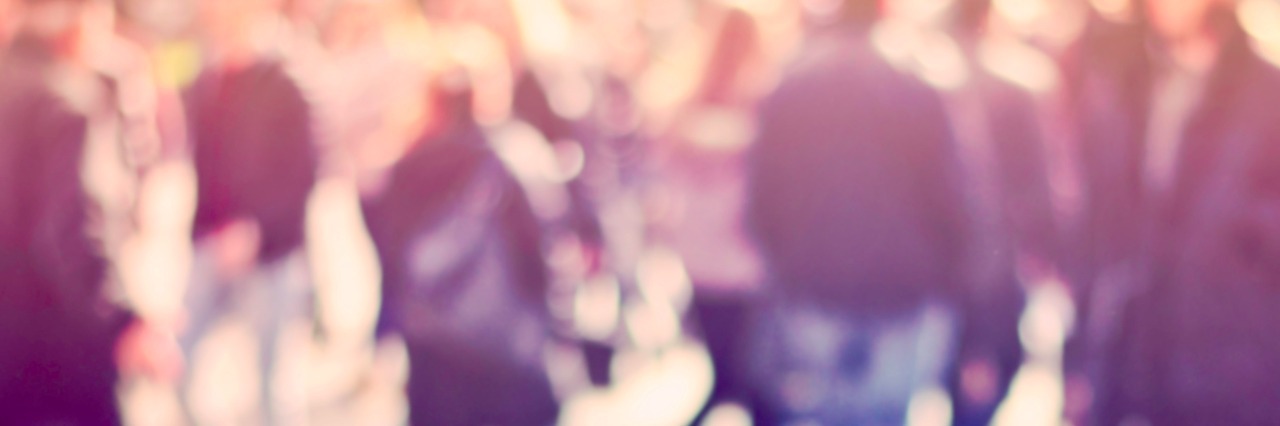 Learning More About Myself as an Autistic Person Blurred photograph of pedestrians walking on street