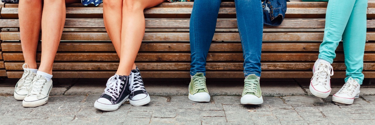 Social Anxiety Doesn't Always Mean You're Not Social four teenage girls hanging out on the bench