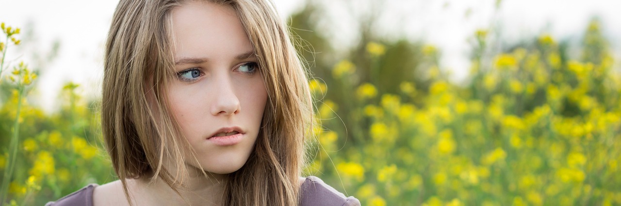 Managing Conflict and Anger With Borderline Personality Disorder young woman looking worried outside