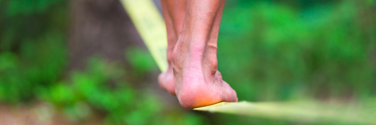 Walking the Tightrope of Anxiety and Depression person walking a tightrope