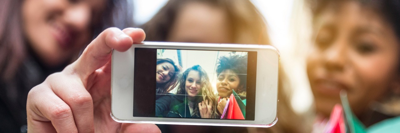 Three women taking a selfie