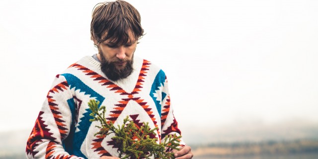 The Days Before Christmas Are Always the Toughest When It Comes to My Depression Man hands holding fir tree branch