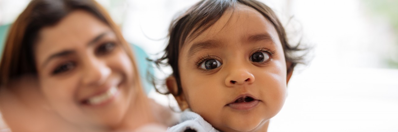 What It's Like to Be a 'Heart Parent' Adorable little girl reaching for camera