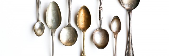 Antique Silver Spoons on White Background