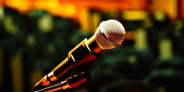 A Speech About Eating Disorders Every High School Student Should Hear A microphone in an assembly