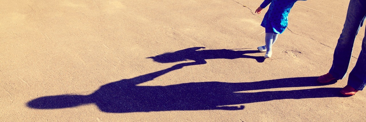 Suicide: My Mom Died by a Mental Illness Shadows of mother and little daughter holding hands on the road