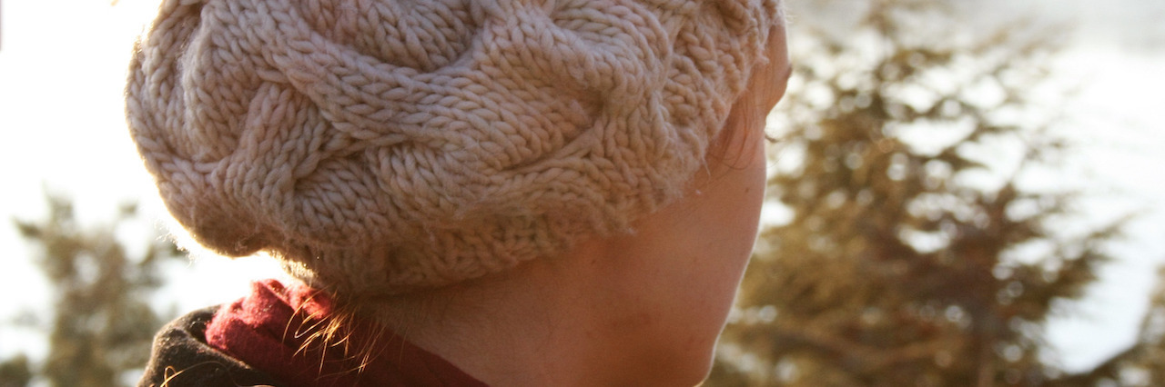 Reflections on My Struggle With Mental Illness and Suicide in 2016 knitting hat woman in sunset time