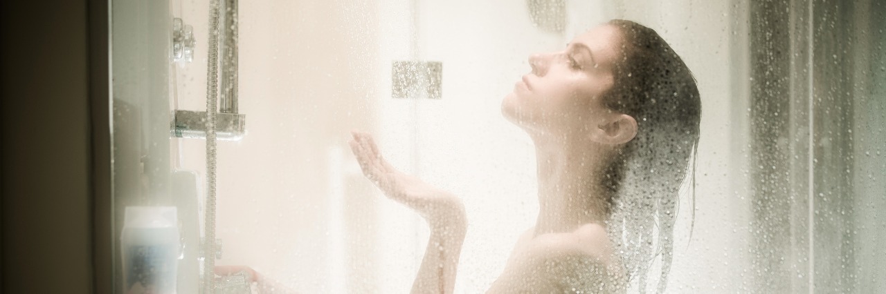 woman taking shower after long stressful day