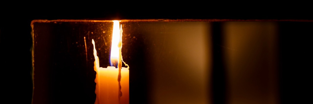 When You Experience Depression Late at Night candle lit in a window