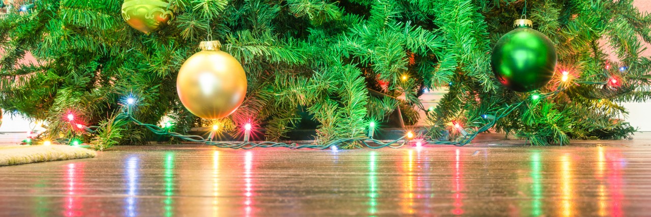Detail of Christmas tree decorations with lights reflections