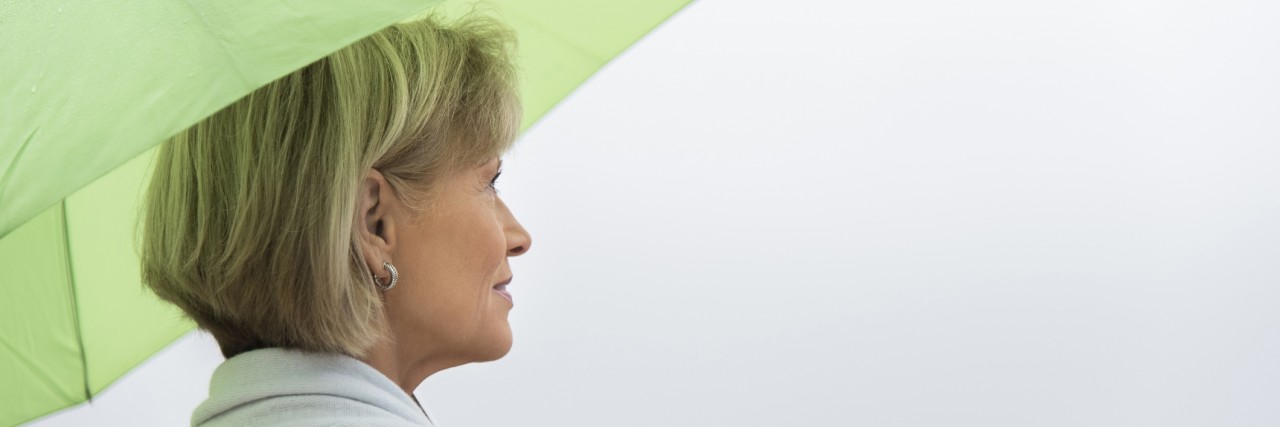 5 New Year's Resolutions From a Person With Lyme Disease Woman With Green Umbrella Against Clear Sky