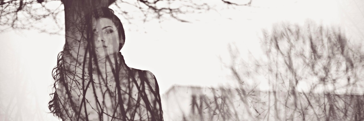 When Borderline Personality Disorder Makes You Question Who You Are woman standing in front of a tree