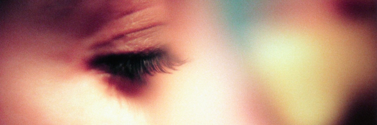 Panic Disorder: Stages of My Panic Attacks Close-up profile photo of woman looking down