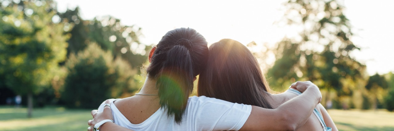 15 Things I Am Grateful to My Mom/Caregiver for Doing to Help Me Closeup of mom and daughter embracing on a park bench