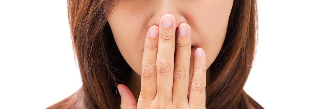 5 Things Not to Say to a Person With Bipolar Disorder young woman with her hand on her mouth