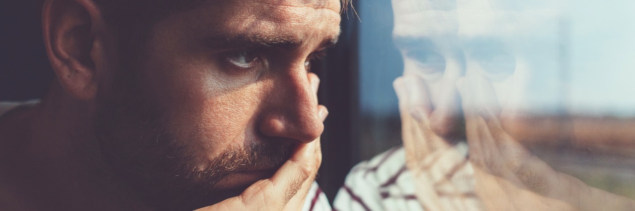 Generalized Anxiety Disorder: When You Can't Stop Worrying sad young man looking through the window