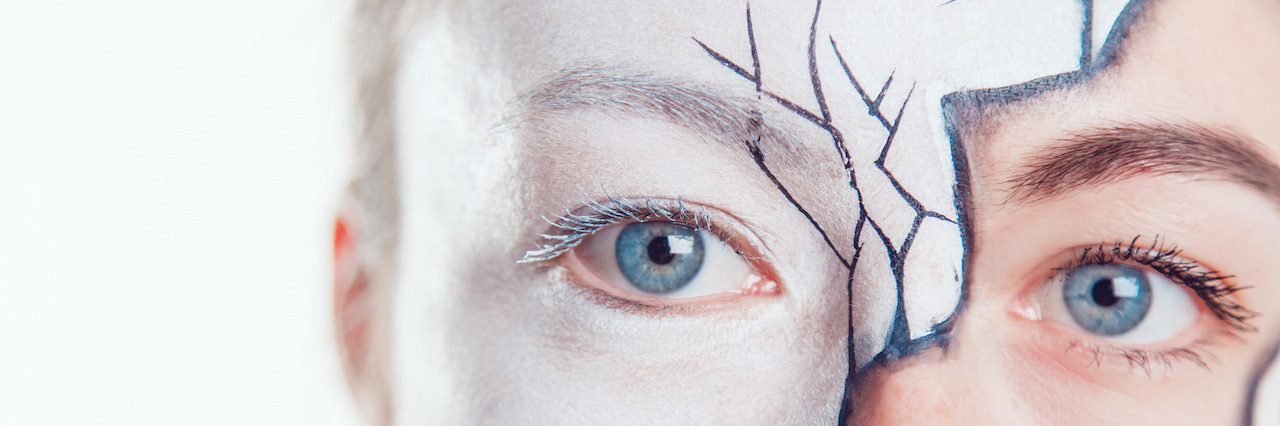 When Anxiety and Depression Invade the Mind Girl with Halloween face art on white background