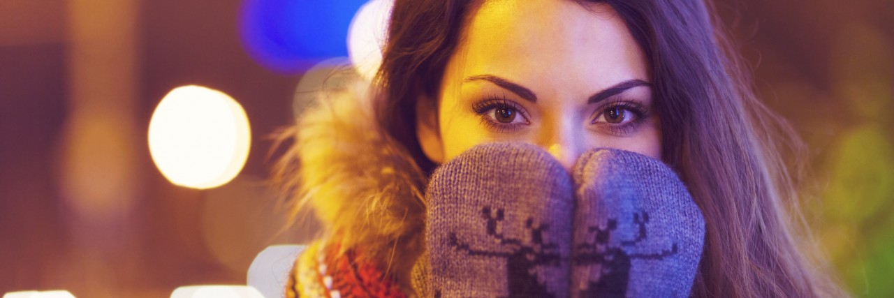 Portrait of young pretty woman outdoor in wintertime