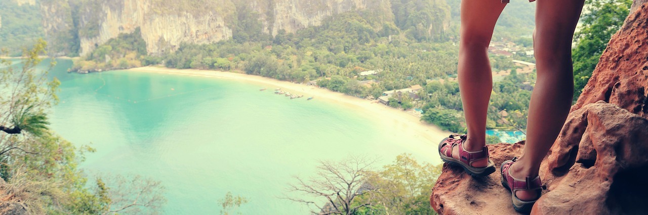 Taking Small Steps in Depression Recovery successful woman hiker enjoy the view on mountain top cliff