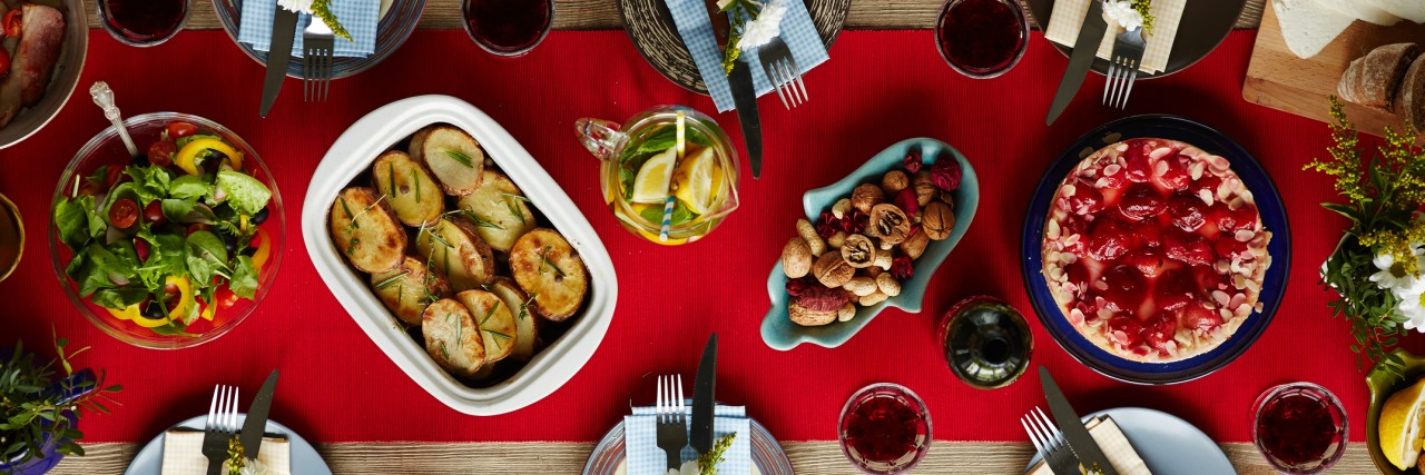 Handling Christmas for My Son With Eosinophilic Esophagitis (EoE) Baked potatoes, strawberry cake, homemade lemonade, vegetable salad, nuts and tableware prepared for dinner