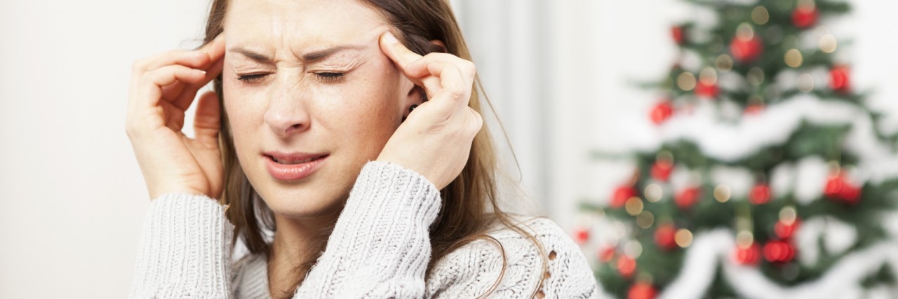 What Misophonia Feels Like on Christmas Morning young girl has headache of christmas stress