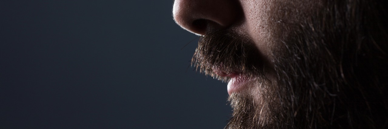 10 Things You Shouldn't Say to a Recovering Alcoholic Profile Close Up of a Man with Brown Beard on Gray Background