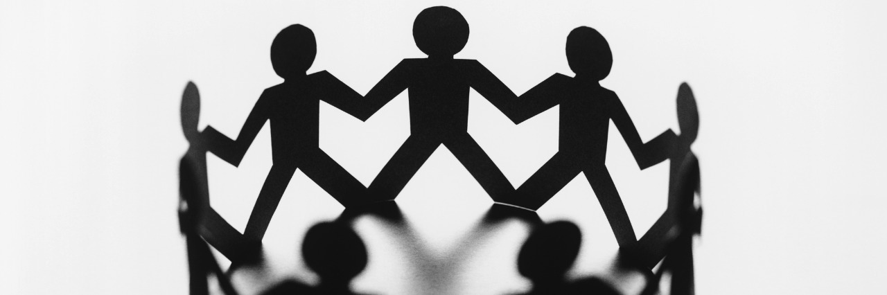 'No One Fights Alone': Support in the Childhood Cancer Community circle of paper dolls connected at the hands