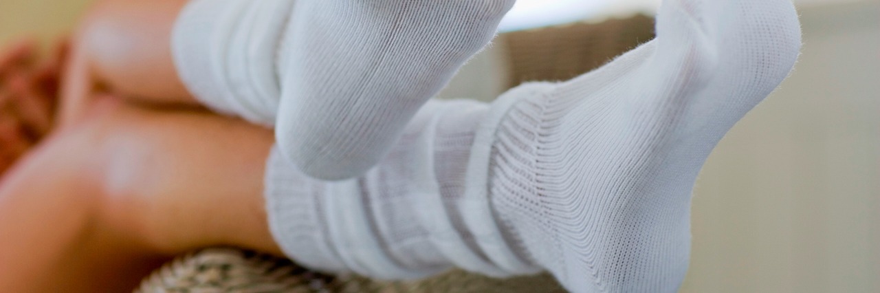 What It's Like to Be on Disability for a Mental Illness Woman wearing socks