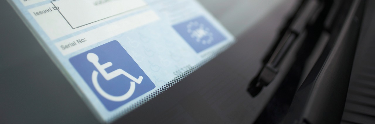 Why I Refuse to Apologize for My Disability handicap sticker on windshield