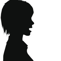 Silhouette of woman talking to man