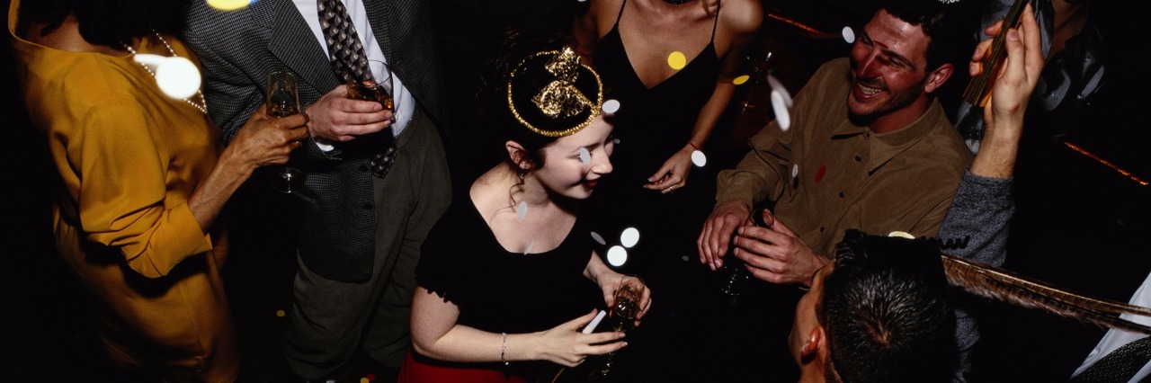 New Year Resolutions for People With Social Anxiety people celebrating the new year at a party