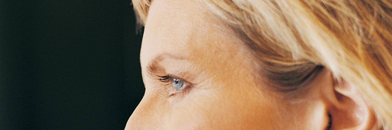 Canceling Plans Because of Hypothyroidism: My Response to Friends Close Up Portrait of a Mature, Female CEO With Her Hand on Her Chin