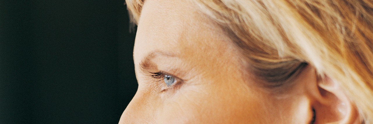 Close Up Portrait of a Mature, Female CEO With Her Hand on Her Chin