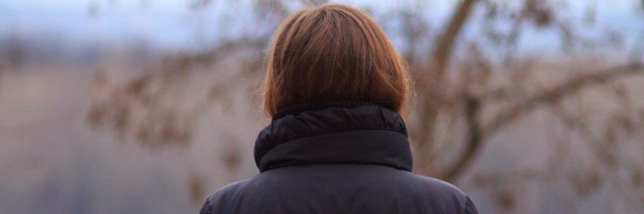 Letter to My Loved Ones Who Question Whether My Pain Is Real woman staring at the landscape